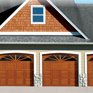 house with wood garage doors and black roof