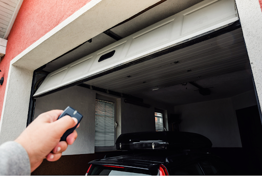 a residential homeowner unsuccessfully trying to operate a garage door that is stuck halfway