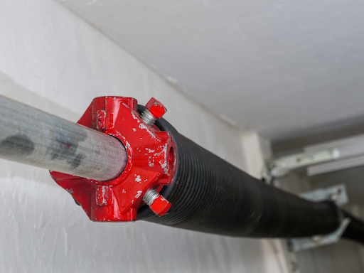 A recently replaced residential garage door cable